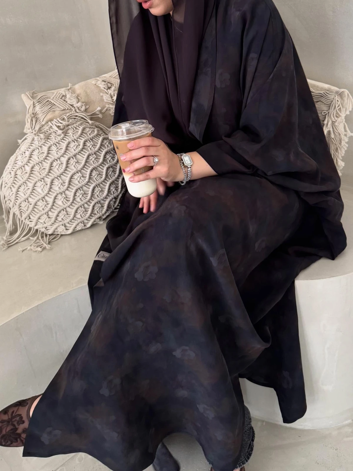 Detail of a dark patterned Ciel abaya